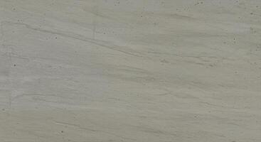 Light gray stone surface presents a subtle texture for modern design backdrops. photo