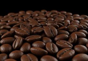 A tempting pile of fresh roasted coffee beans creates a rich and inviting scene. photo