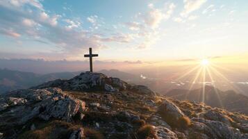 Wooden cross on mountain top during sunrise. Black space photo