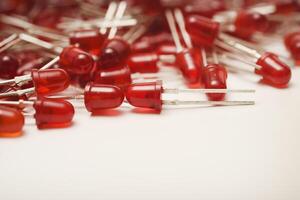 Red LED bulbs on a white background. The radio element is an LED lamp. photo