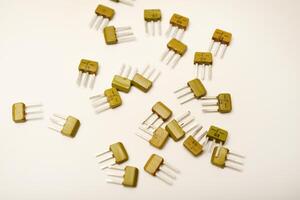 Old-school transistors on a white background. Tech hardware. photo