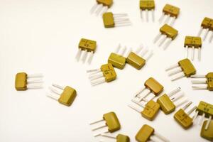 Traditional transistors on a white stage. Hardware elements. photo