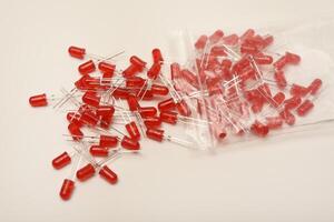 Multihued red and orange LED bulbs. LED circuitry element. photo