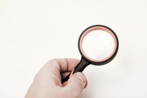 A magnification device for the visually impaired.Magnifying glass on a white background. photo