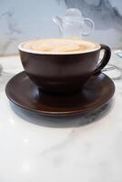 Soft and delicate milk froth in a cup of hot coffee photo