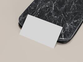 Top view of a clean business card placed on marble mockup. photo