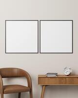 Two black square photo frames on a wall above a desk with a brown chair and a clock, perfect for contemporary design displays.