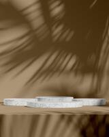Contemporary Marble Display Stand with Elegant Shadow Patterns photo