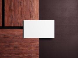 Elegant business card placed on wooden surface with a minimalist design, perfect for corporate branding and professional identity. photo