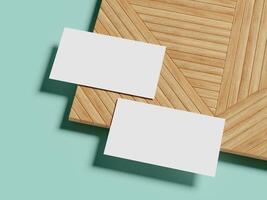 A minimalistic business card mockup set on a textured wood background, featuring soft shadows and a pastel blue backdrop for an elegant and clean aesthetic. photo