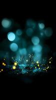 Glowing teal bokeh lights sparkle on dark background. photo
