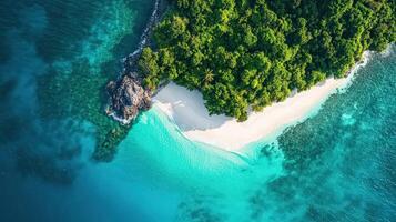 Overhead view of tropical island with white sandy beaches and water photo