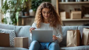 Relaxed Woman Shopping Online, Adding Items, Surrounded by Packages photo