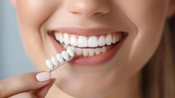 High-Resolution Image of Woman Smiling with Dental Whitening Tray photo