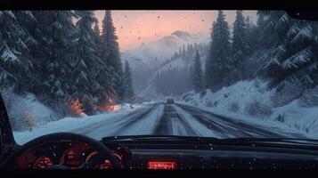 Passenger perspective of snowy mountain road, pine trees, foggy windshield photo