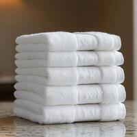 Neatly Folded Plush Towels in White, Perfect for Relaxing Spa Days photo