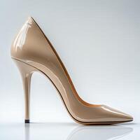 Stylish Beige High Heels Isolated Against a Crisp White Background photo