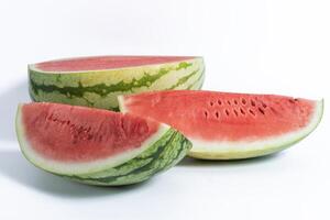 Freshly cut watermelon slices displayed against a white background photo