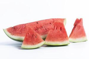 Freshly cut watermelon slices on a white background, closeup photo