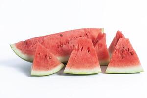 Freshly cut watermelon wedges on a white background for summer refreshment photo