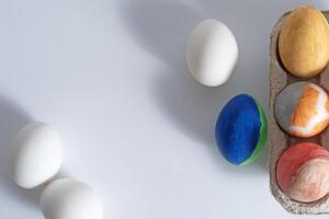 Colorful easter eggs in a cardboard box photo