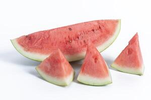 Freshly sliced watermelon pieces on a white background photo