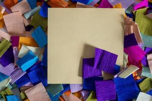 A piece of paper surrounded by colorful paper photo