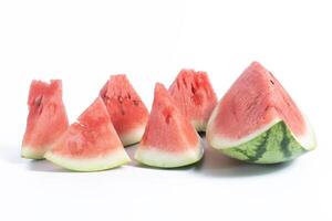 Freshly cut watermelon slices displayed on a white background photo