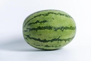 Closeup of a fresh whole watermelon isolated on a white background. photo