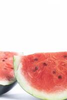 Close-up of fresh juicy watermelon slices on white background, vertical shot photo