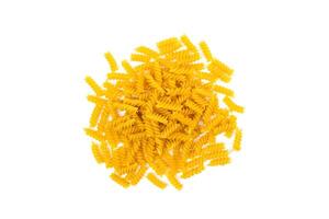 Fusilli paste spiral shape isolated on a white background. Top view. Selective focus. photo