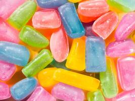 Colorful sweet wax candies close up photo