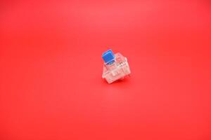 Gaming Keyboard Blue Switch Isolated Against Red photo