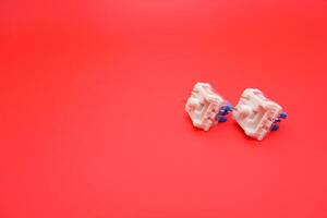 Close-Up of Blue Switch for Mechanical Keyboard on Red Backdrop photo