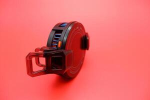 Gaming Phone Cooler with Insulated Clamp on Red Background photo