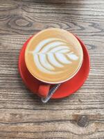 Artistic Latte in a Red Cup photo