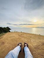 Relaxing at Sunset on a Cliff Edge photo