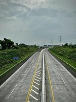 Empty Highway Under Cloudy Sky photo