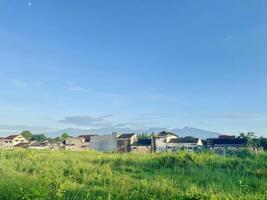 Landscape of Mountain Range and Old Buildings photo