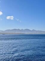 Scenic View of Bali Strait with Deep Blue Ocean and Clear Sky Overlooking the Island of Bali. Serene Seascape, Natural Horizon, Tropical Destination, Travel, Coastal Photography, Marine photo
