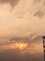 Serene Sunset with Clouds and Metal Structure photo