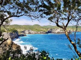 Scenic Coastal View with Turquoise Ocean and Cliffs. Angels Bilabong Nusa Penida Bali. photo
