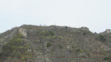 The mountains landscape with the broken Great Wall in the early spring photo