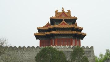 The corner pavilon located in the corner of the Forbidden City of Beijing photo