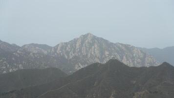 The broken watching tower on the mountains in spring photo
