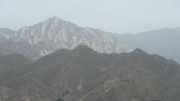 The landscape with the Great wall on the mountains photo