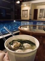 Nighttime Poolside Dining with Soup photo