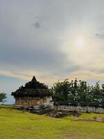 Ancient Stone Temple Under Cloudy Sky. Candi Ijo Temple Yogyakarta photo