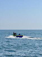 Inflatable Boat Ride on Calm Sea. Capture from Utama Raya Situbondo photo
