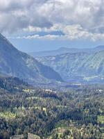 Lush Green Mountain Landscape Under Cloudy Sky. Seruni Point Bromo photo